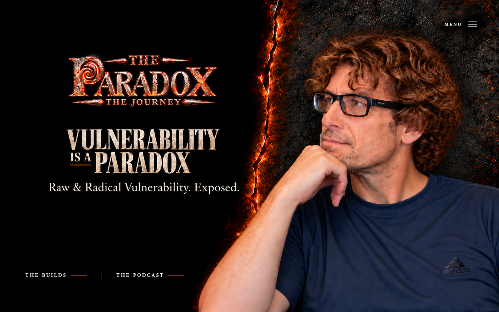 The Paradox | The Journey. Vulnerability is a Paradox. Raw & Radical Vulnerability. Dan against forged steel with a glowing orange seam.